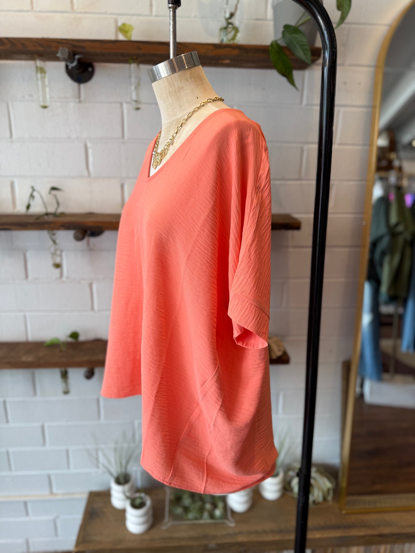 Coral Woven Airflow V-Neck Long Hem Short Sleeve Top