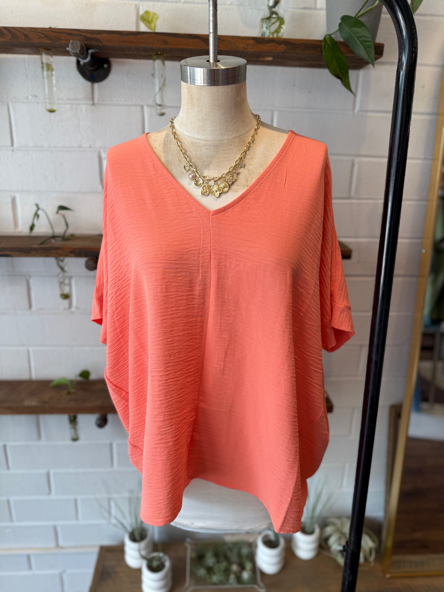 Coral Woven Airflow V-Neck Long Hem Short Sleeve Top
