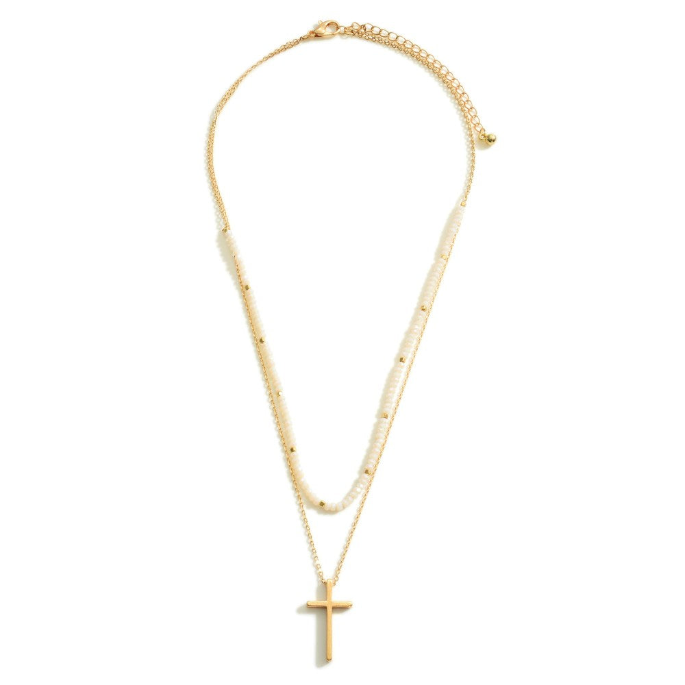 Layered Gold Necklace Featuring a Cross Pendant and Beaded Accents.