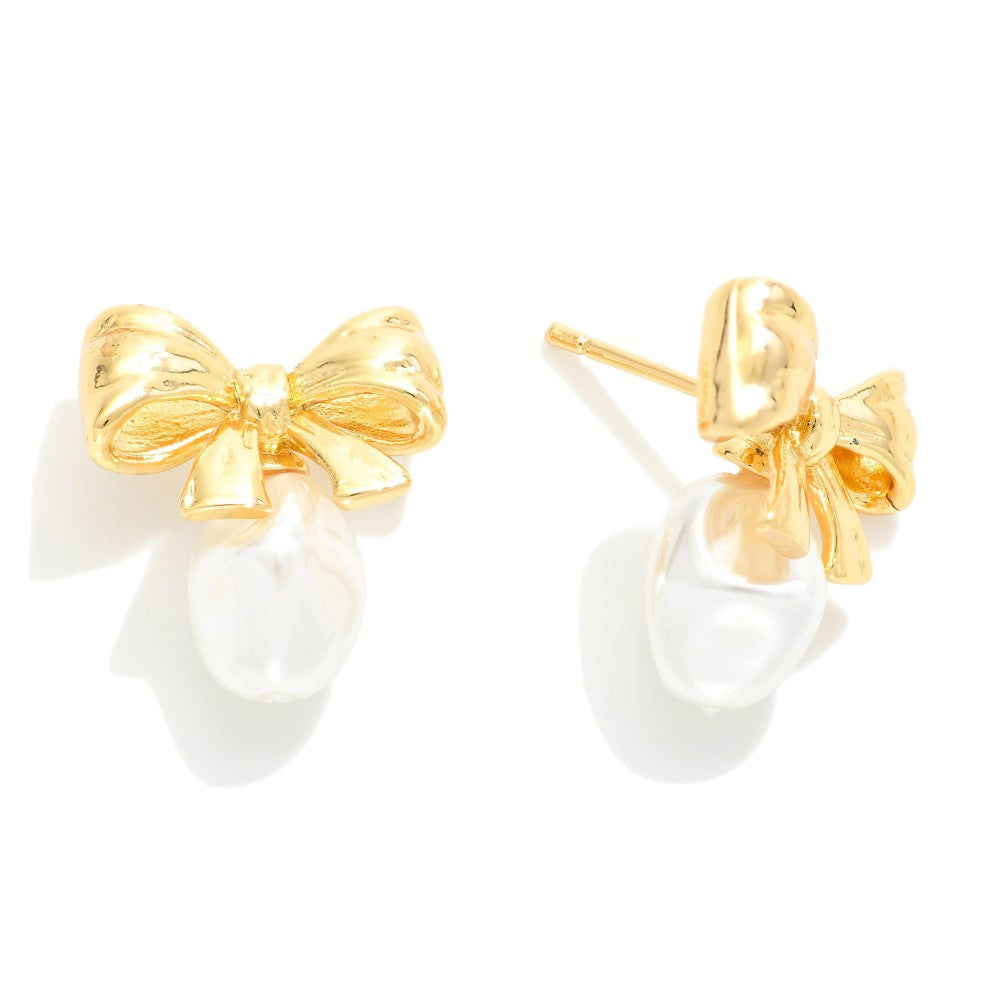 Metal Tone Bow Stud Earrings Featuring Pearl Detail
