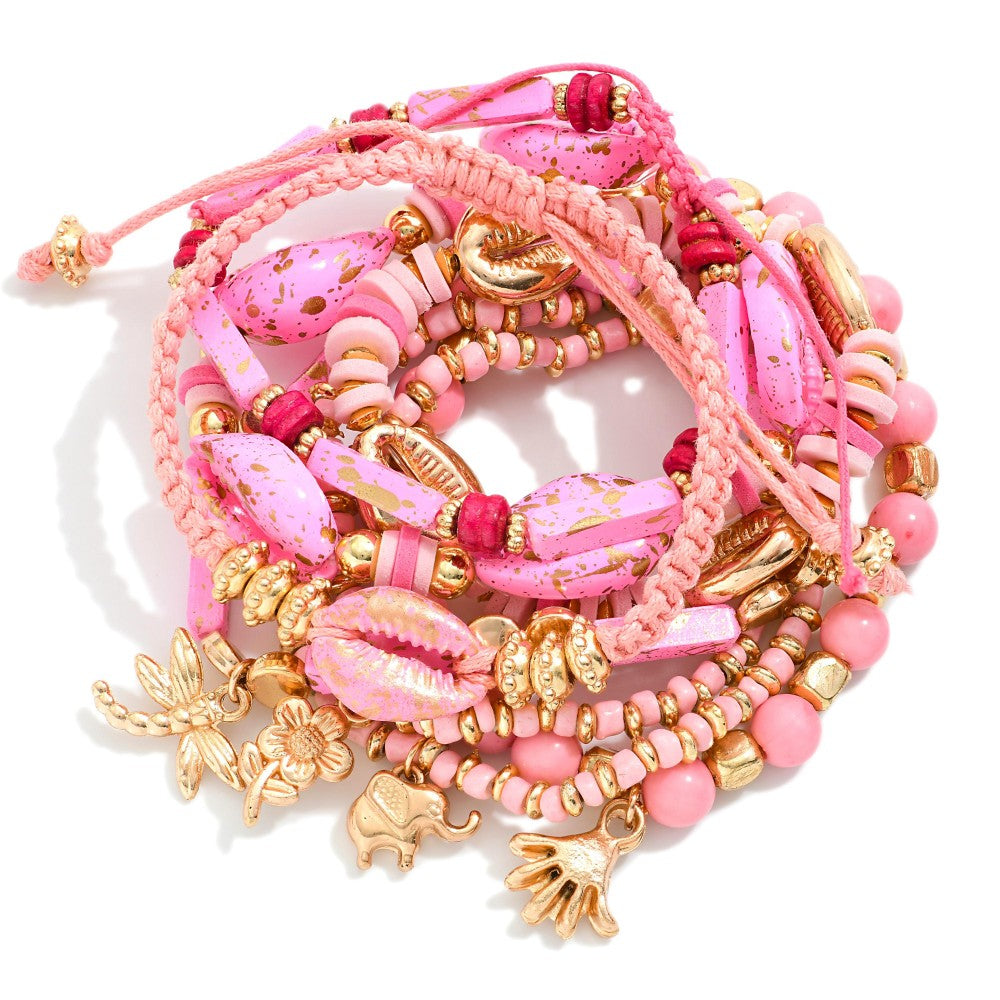 Set Of Nine Beaded Stretch Bracelets Featuring Gold Speckled Cowrie Shells, Gold Tones, & Charms