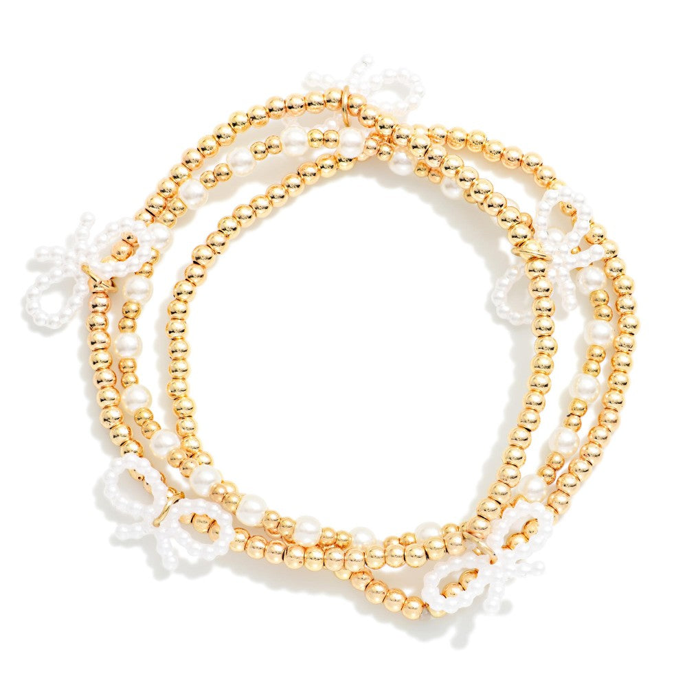 Set Of Three Metal Tone & Pearl Beaded Stretch Bracelets With Bow Details - Gold