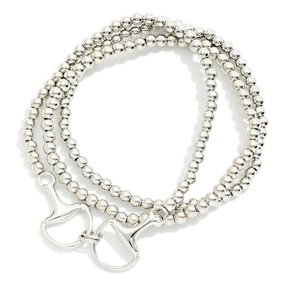 Set Of Three Metal Tone Beaded Stretch Bracelet Featuring Horsebit Charm